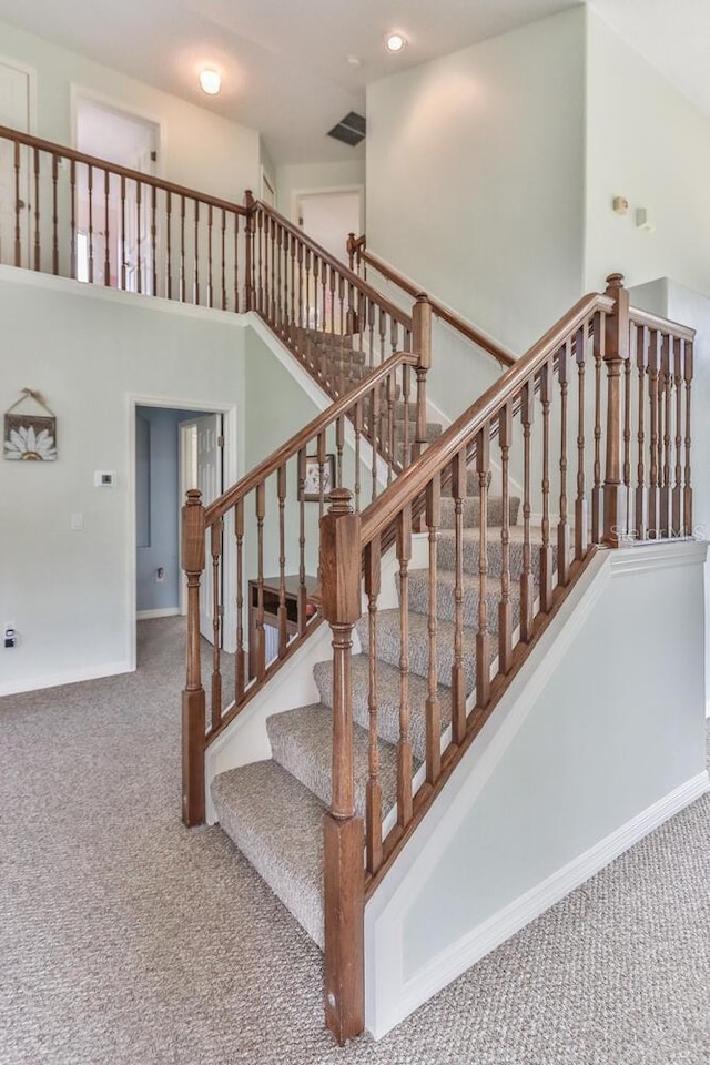 12 S Lakewalk Dr, Palm Coast, FL 32137 - staircase with carpet, baseboards, and recessed lighting