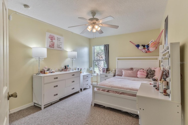 12 S Lakewalk Dr, Palm Coast, FL 32137 - bedroom with light carpet, a textured ceiling, ceiling fan, and baseboards