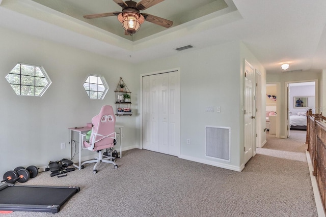 12 S Lakewalk Dr, Palm Coast, FL 32137 - office with carpet flooring, a ceiling fan, a raised ceiling, and baseboards