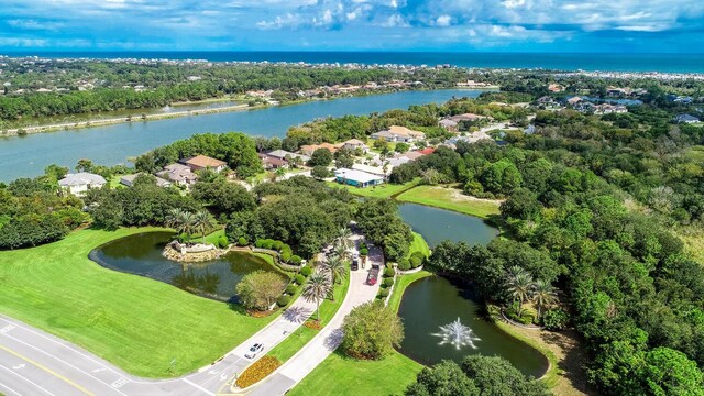 12 S Lakewalk Dr, Palm Coast, FL 32137 - aerial overview of property's location featuring a nearby body of water, a tree filled landscape, and nearby suburban area