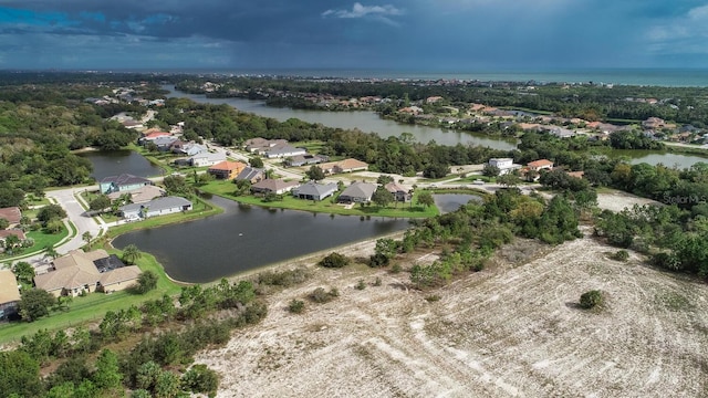 drone / aerial view with a water view