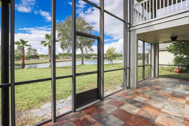 12 S Lakewalk Dr, Palm Coast, FL 32137 - unfurnished sunroom featuring a water view and ceiling fan