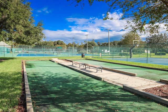 view of community with tennis court