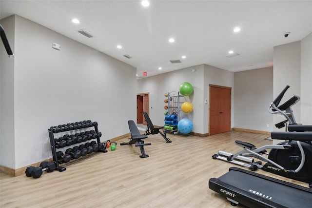 exercise room featuring light hardwood / wood-style flooring