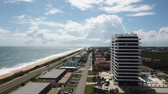 bird's eye view featuring a beach view and a water view