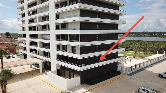 1601 N Central Ave Unit 104, Flagler Beach, FL 32136 - view of building exterior with a water view