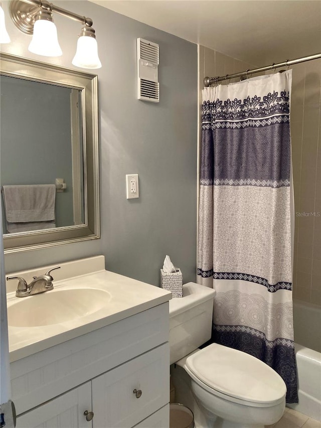 full bathroom featuring vanity, toilet, and shower / bath combo