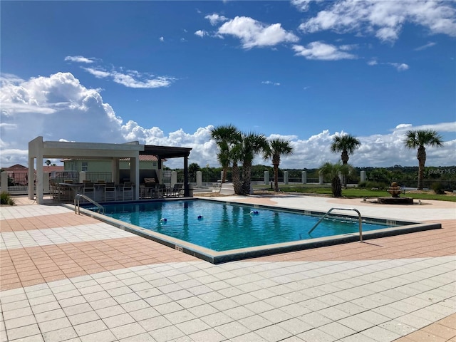 view of swimming pool featuring a patio