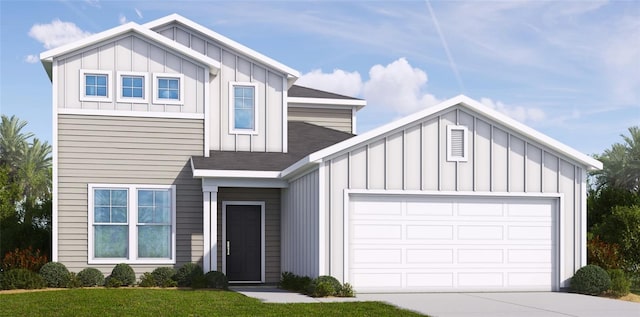 view of front of property with a garage and a front lawn