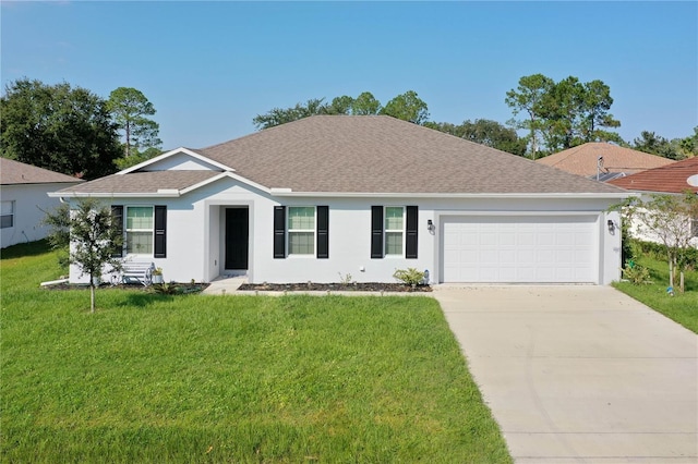 single story home featuring a garage and a front lawn