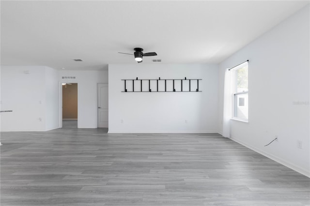 spare room with light hardwood / wood-style floors and ceiling fan