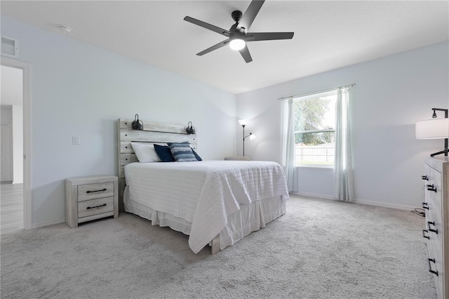 bedroom with light colored carpet and ceiling fan