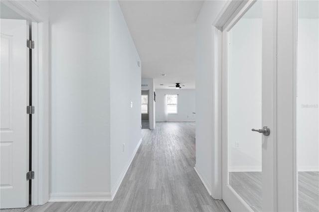 hallway featuring light wood-type flooring