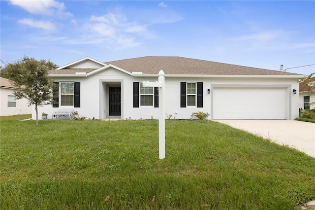 single story home featuring a garage and a front lawn