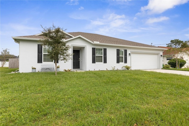 view of front facade with a garage and a front yard