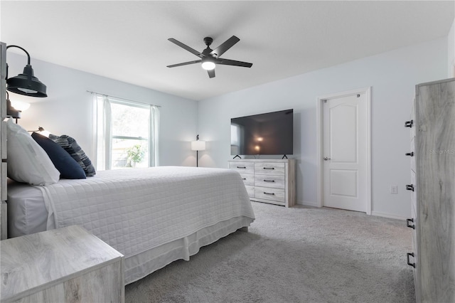 bedroom featuring ceiling fan and carpet floors