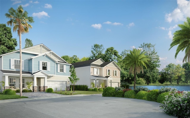 view of front of property with a water view and a garage