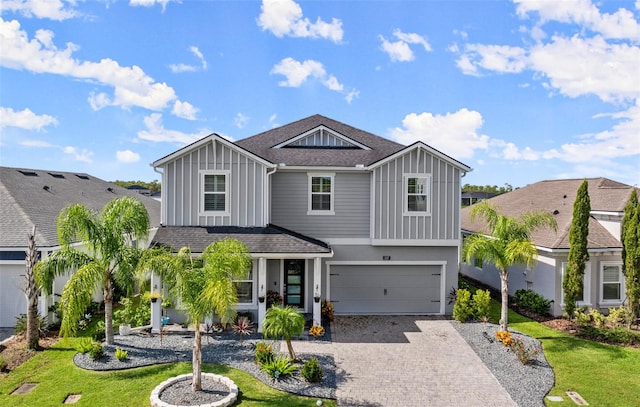 view of front facade featuring a garage and a front yard