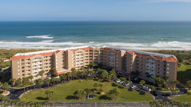 aerial view featuring a water view and a beach view