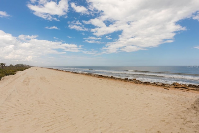 view of water feature with a beach view