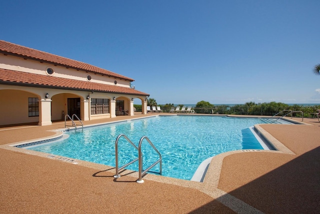 view of swimming pool with a patio area