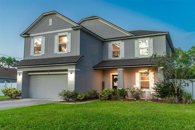 view of front facade featuring a front yard and a garage