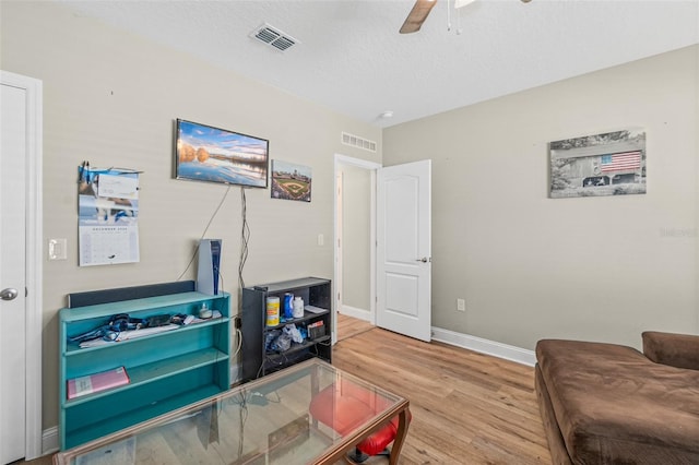 interior space featuring ceiling fan and hardwood / wood-style flooring