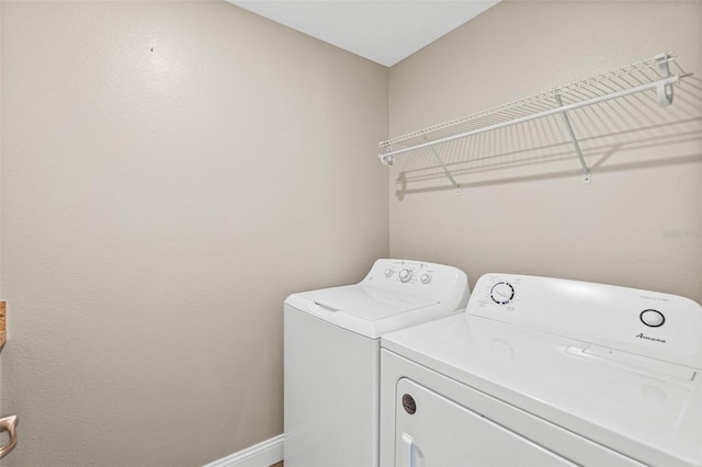 clothes washing area featuring washing machine and clothes dryer