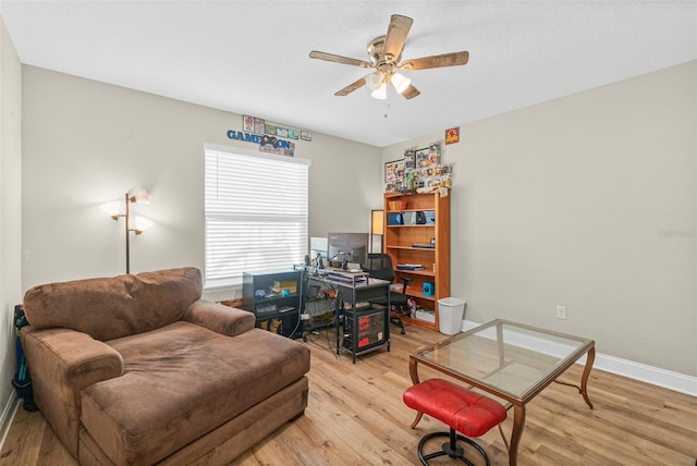 interior space featuring light wood-type flooring and ceiling fan