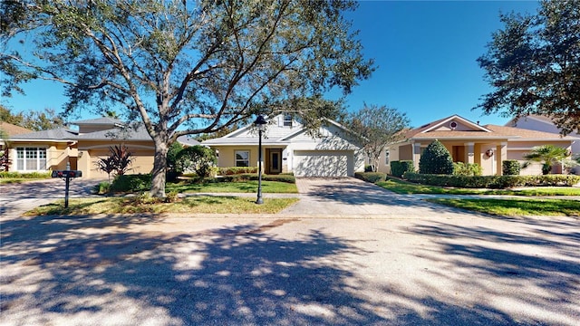 single story home featuring a garage and a front lawn