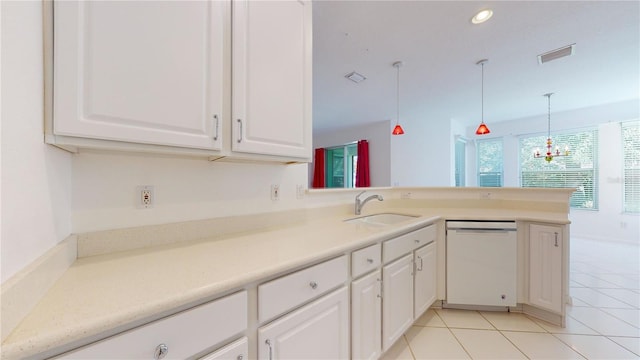 kitchen featuring dishwasher, sink, hanging light fixtures, kitchen peninsula, and white cabinets