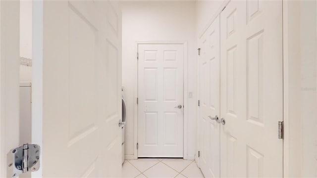 hallway with light tile patterned floors