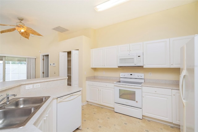 kitchen featuring white appliances, ceiling fan, white cabinetry, and sink