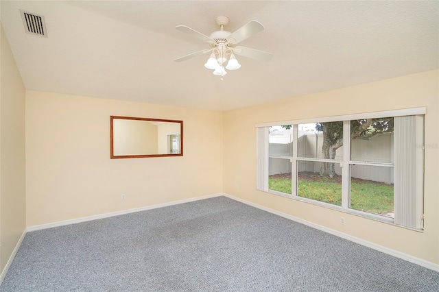 unfurnished room with ceiling fan and carpet floors