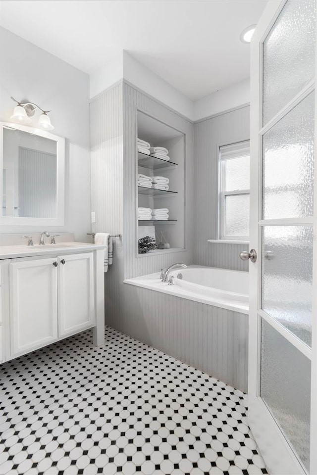 bathroom with a bathtub and vanity