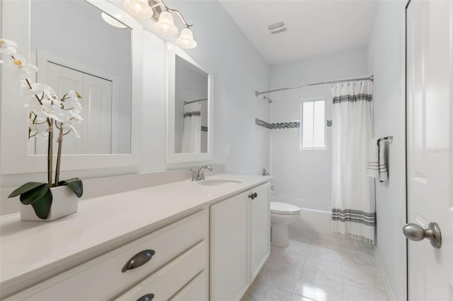 full bathroom with vanity, tile patterned floors, toilet, and shower / bath combo