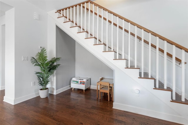 stairway with hardwood / wood-style floors