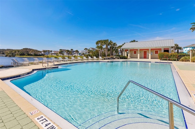 view of swimming pool featuring a patio area