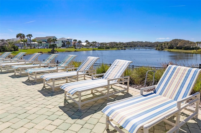 view of patio with a water view