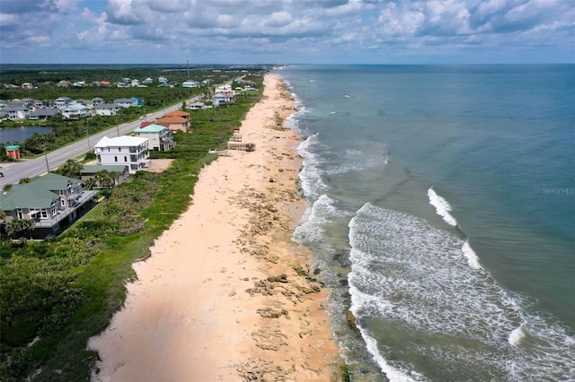 bird's eye view with a water view and a view of the beach