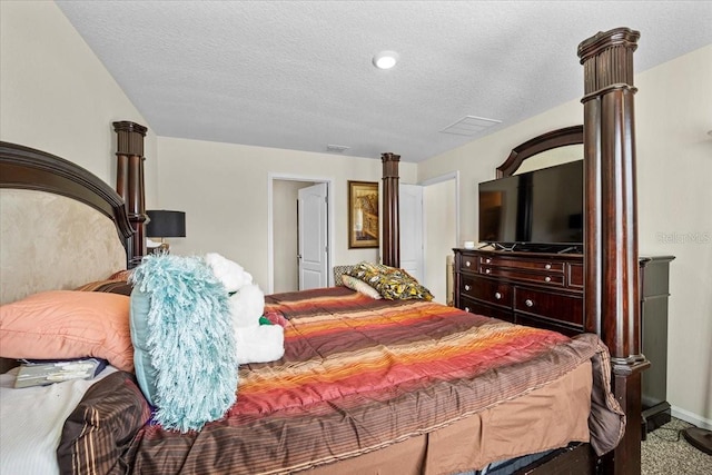 carpeted bedroom with a textured ceiling