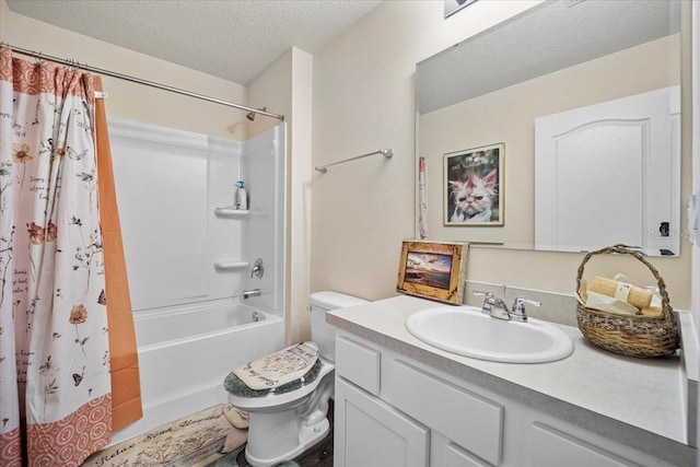 full bathroom with vanity, shower / tub combo with curtain, toilet, and a textured ceiling