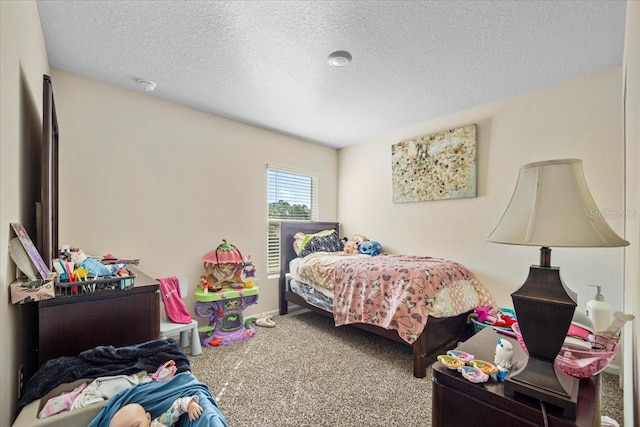 carpeted bedroom with a textured ceiling