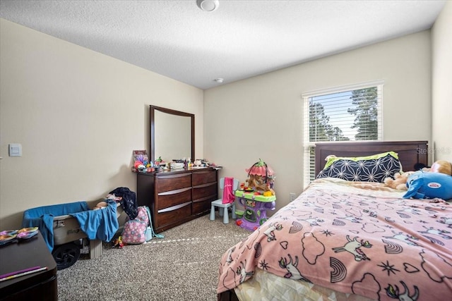 carpeted bedroom with a textured ceiling