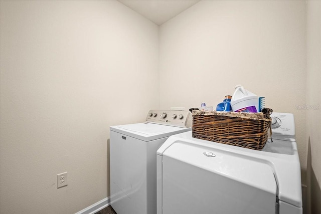 washroom featuring washing machine and dryer