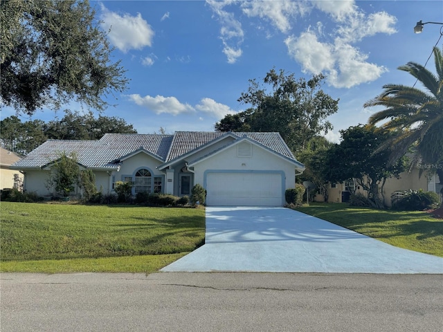 view of front facade featuring a front yard and a garage