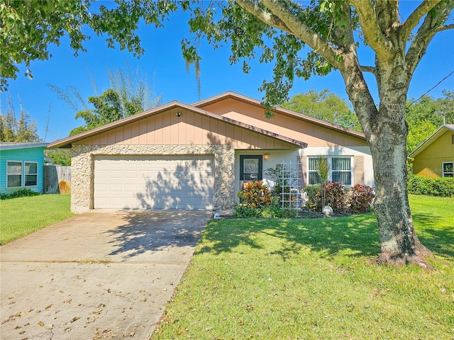 single story home with a front yard and a garage