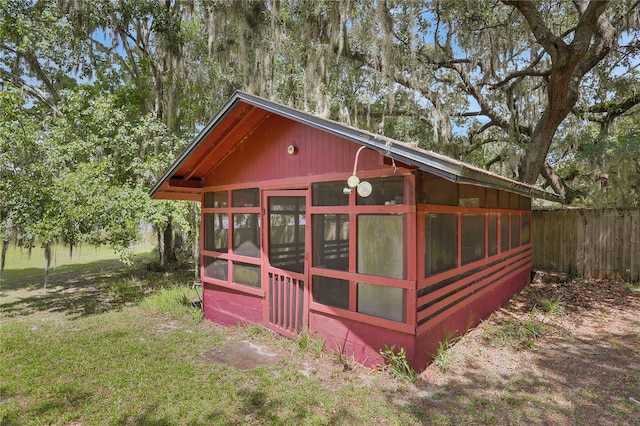 view of outdoor structure with a lawn