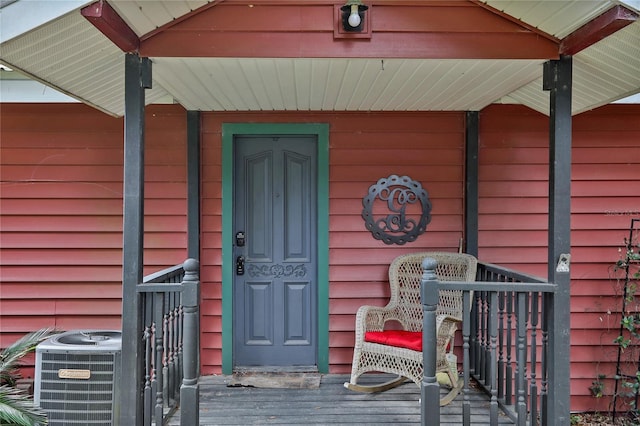 doorway to property with central AC unit