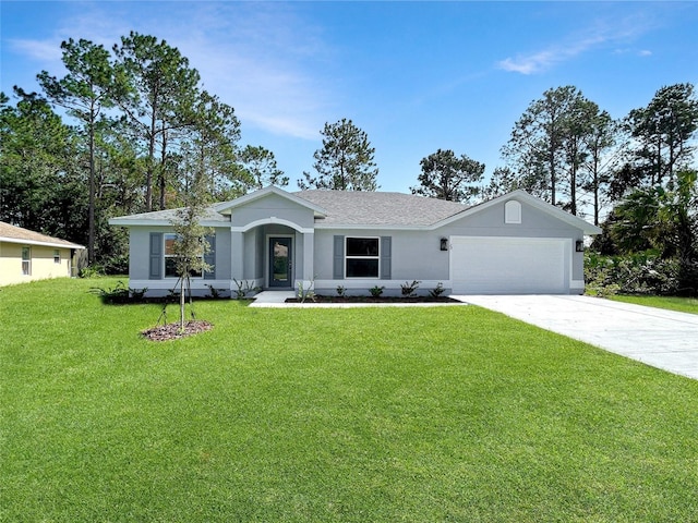 ranch-style house featuring a front yard and a garage